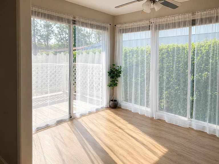 Sunroom with an exit to the deck