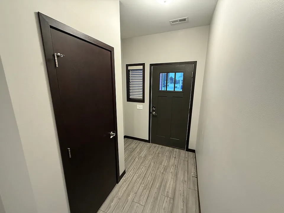 Foyer with coat closet and space for a bench