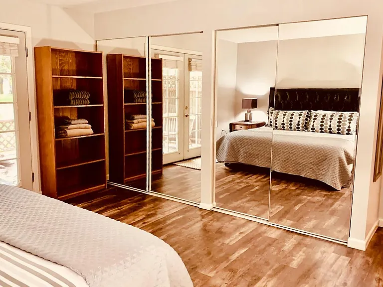 Large double door mirrored closets, tons of space. Shelving inside for organizing til your heart's content. Also large dresser (not pictured).