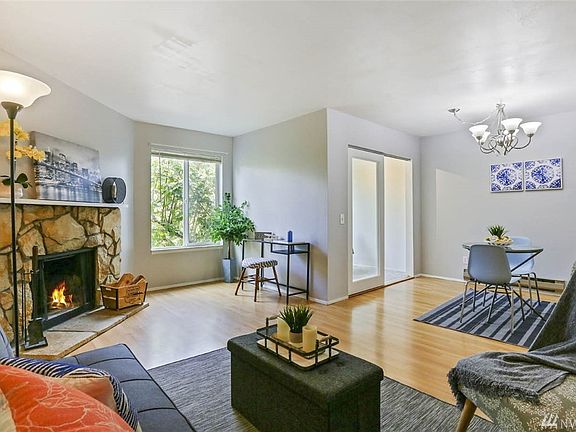 The open floor plan and large windows give this space an airy feel. 