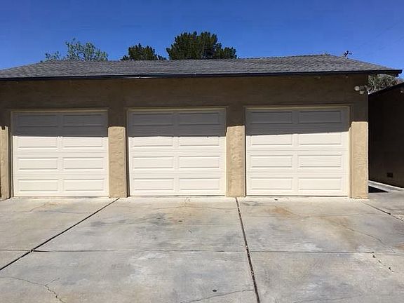 back unit has garage on left and middle