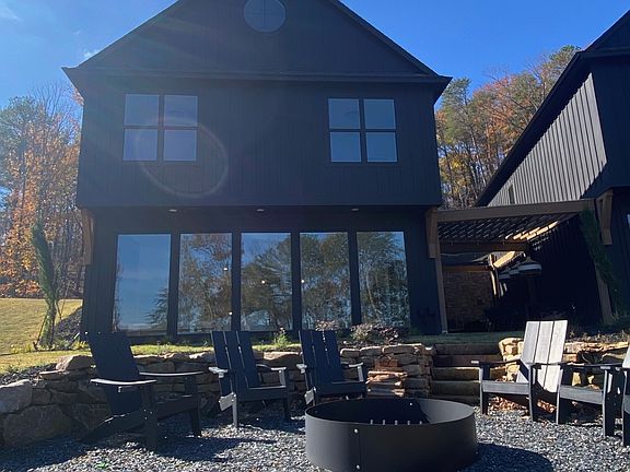 Rear view of home, with firepit