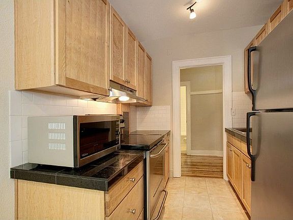 Galley kitchen with SS appliances and granite counter tops!