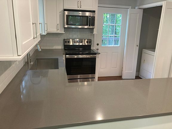 Kitchen with access to deck and W/D