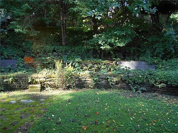 View of the backyard looking out the living room picture window. Private and peaceful!