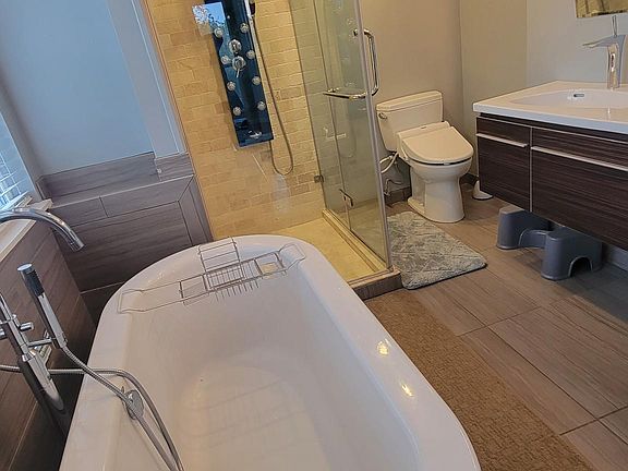 Upgraded Full size master bathroom with heated floor, heated ceiling vent, and heated towel bars. Double sinks.