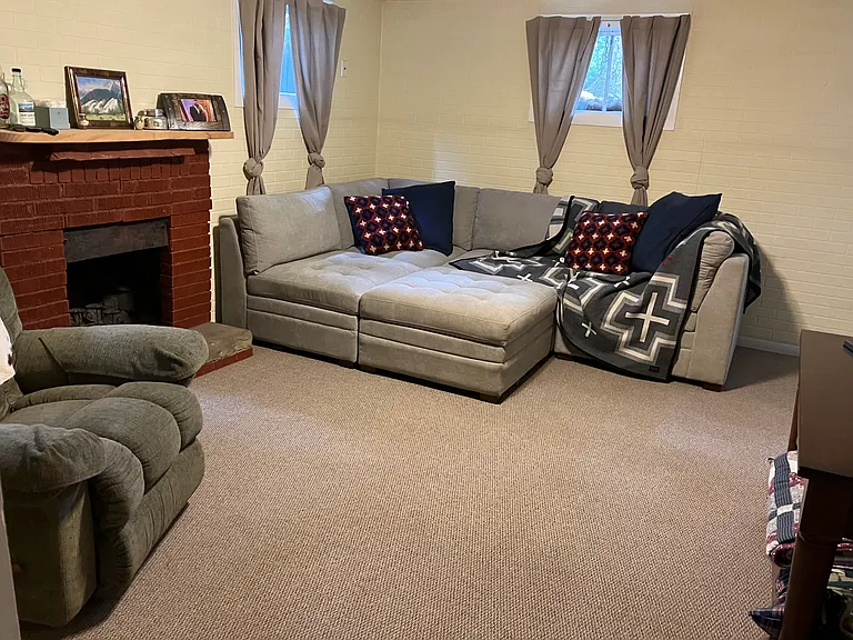 living room *(NOTE: fireplace can only be used with candles/ candelabras at this time)