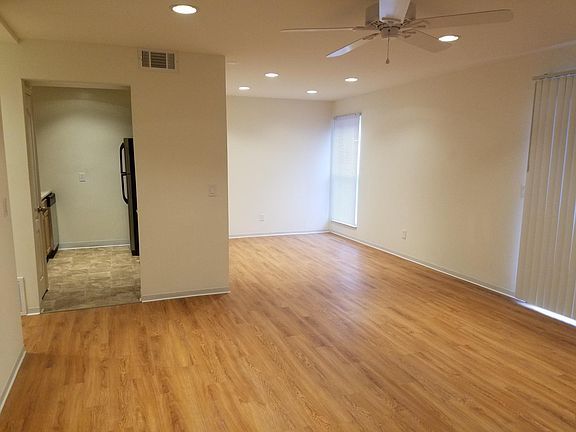 View of living room, dining room, and kitchen