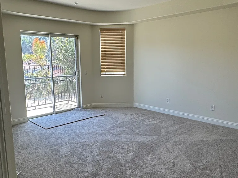 Second Master Bedroom with access to backyard. En-suite bathroom.