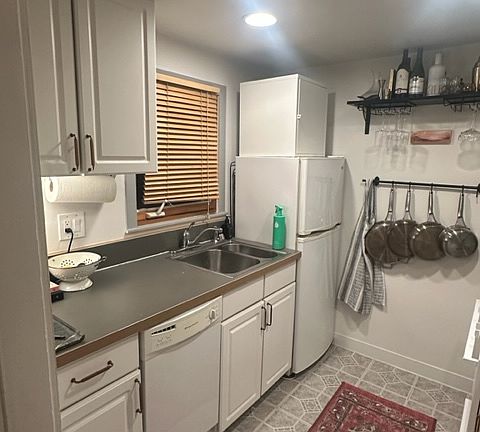 Kitchen with window looking out to common area. Lots of natural light.