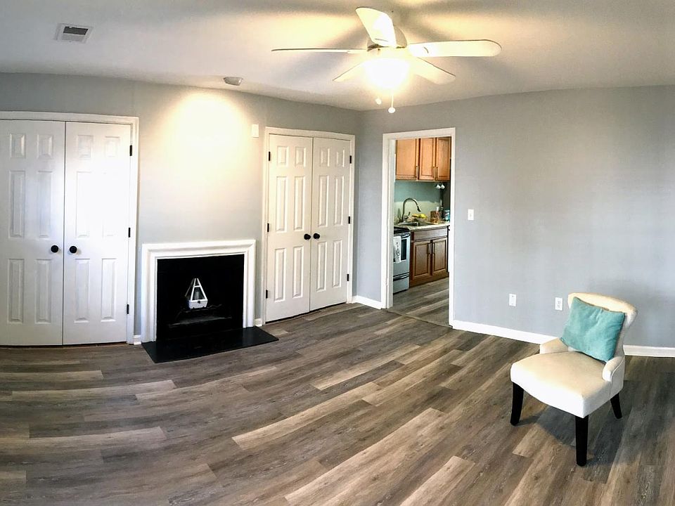 Spacious living room with built in storage closets, fireplace. Previous tenant had an 8-person L-shaped couch with room to spare.
