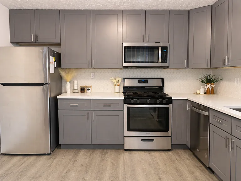 Ground floor - kitchen with new cabinets, appliances and quartz countertop