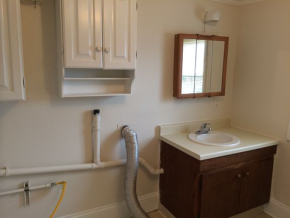 Bathroom with hook-ups for laundry