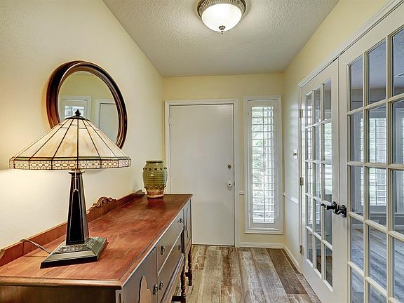 View of the Foyer and Formal Dining Through French Doors.