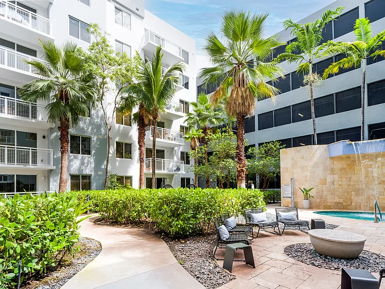 Lush Landscaped Courtyard With Seating Nooks