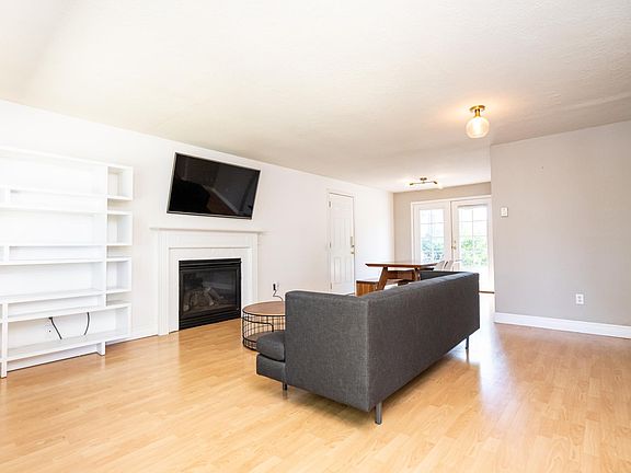 Livingroom with gas fireplace and 55" LG smart TV with Chromecast. HDMI out adjacent to fireplace for your devices. Facing southwest. (Furniture not included.)