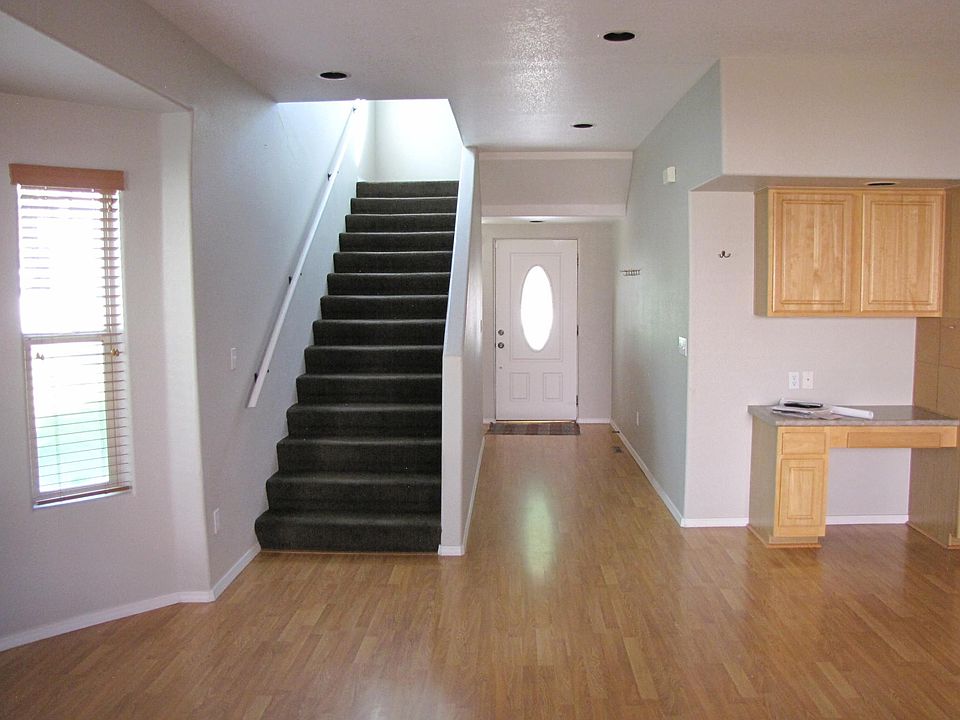 Downstairs in all wood laminate. Upstairs is all carpeted.