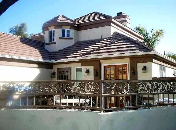 The front yard has a spacious courtyard which is gated. The french door from the kitchen leads out to the courtyard.