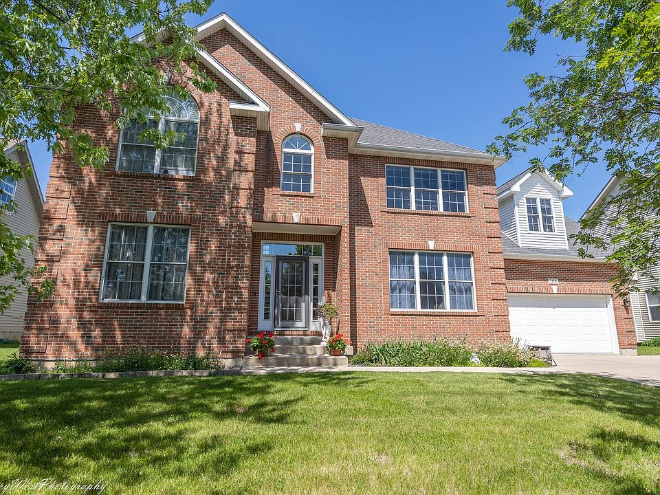 Brick front & concrete driveway