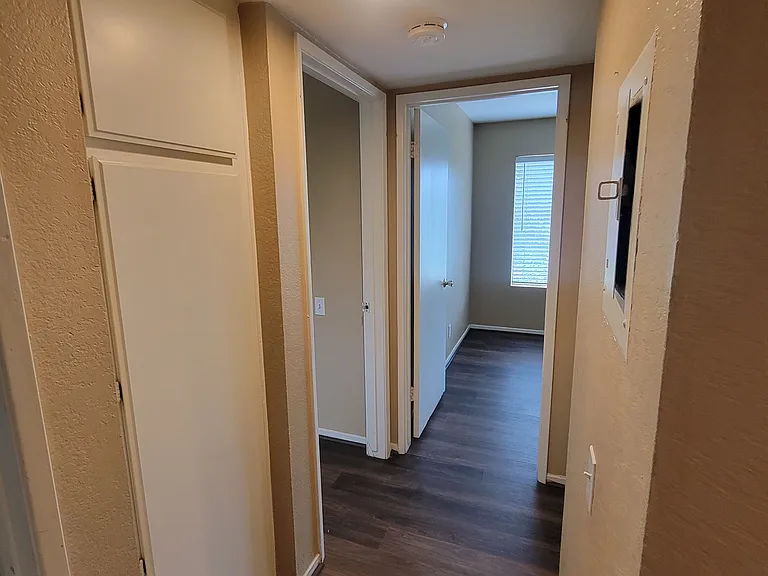 hallway with linen cabinet