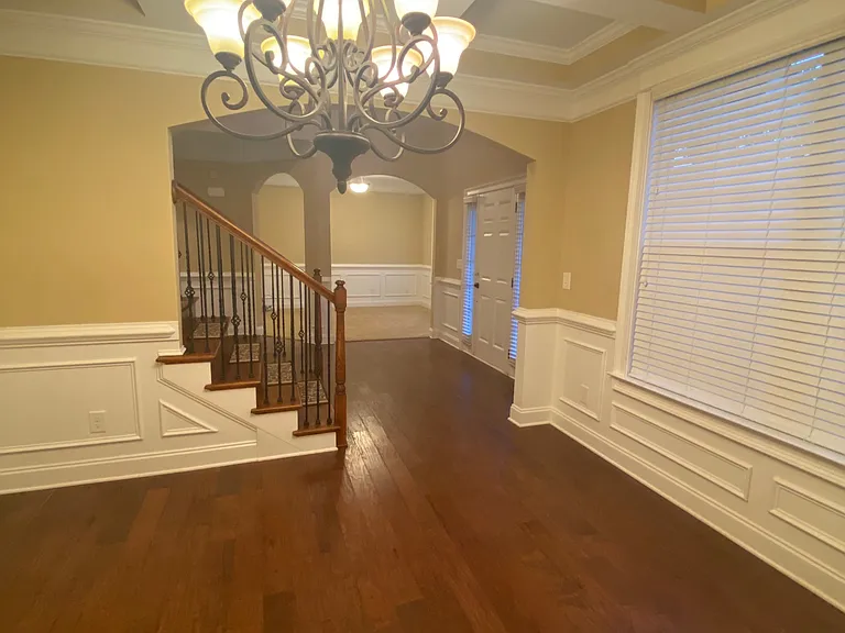 Formal Dining Room with upscale chandelier