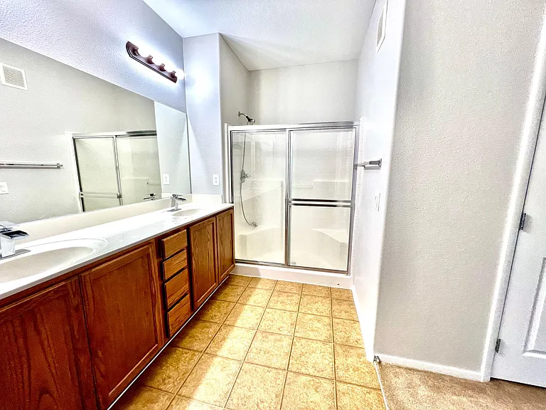 primary bathroom with double vanities
