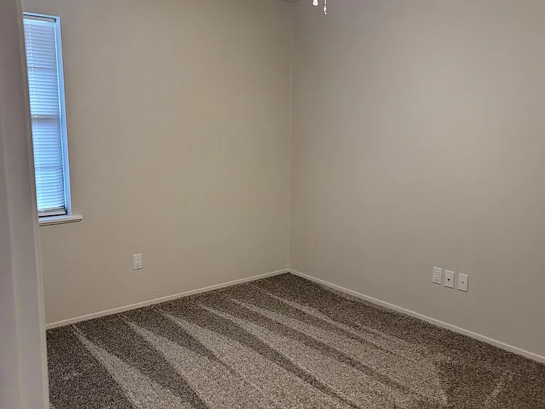 Second bedroom as seen from the hallway entrance.
12'1"x9'10"