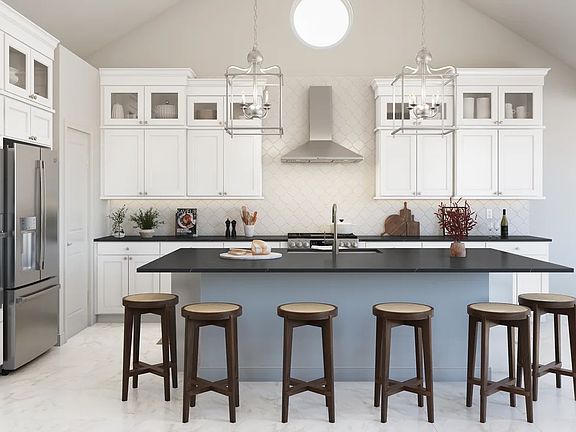 Kitchen with glass upper cabinets and pendant lighting