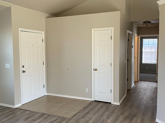 Hallway looking down to other 2 bedrooms and hall bath