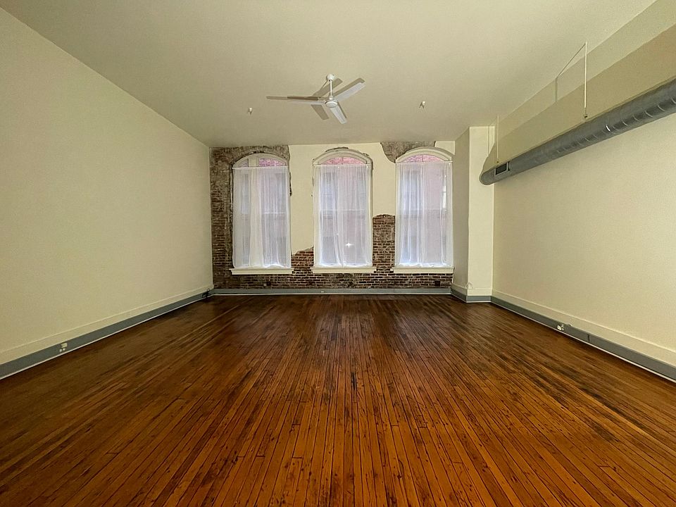 Exposed brick, hardwood floors and floor to ceiling windows.