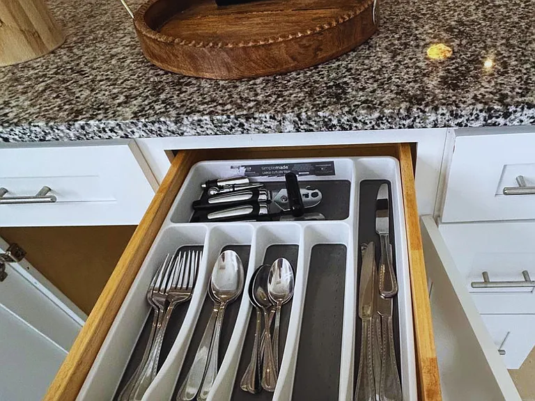 Complete set of forks, knives, and spoons for your convenience.