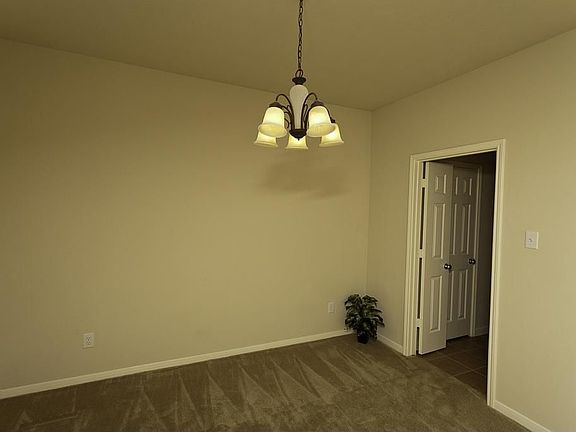 Formal dining room off entry