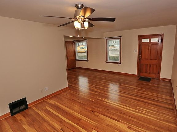 View from living room towards dining room and front entry.  This is also a great view of the just refinished hardwood floors thr