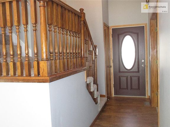 Beautiful wood railing and new laminate floors create a welcoming entrance. The coat closet just behind the front door was originally a half bathroom! It is still stubbed for a half bath.