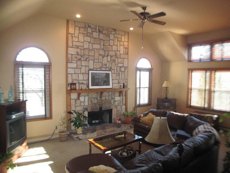 Family Room - Vaulted Ceilings And Stone Fireplace. 