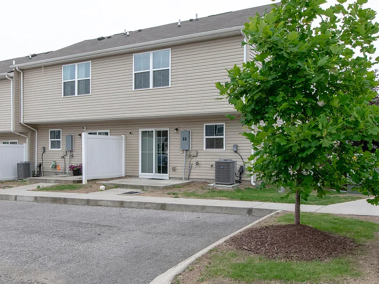 Parking spots located behind the townhouse with direct entry through backdoor.