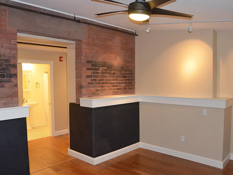 Living Room looking to entry hall and bathroom