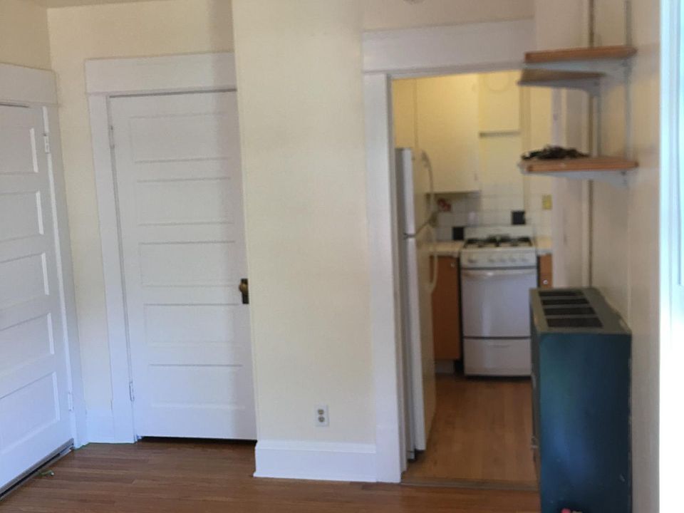 Standing in front room looking into kitchen