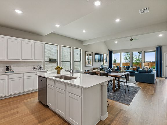 Kitchen in the Stanley II home plan by Trophy Signature Homes - REPRESENTATIVE PHOTO
