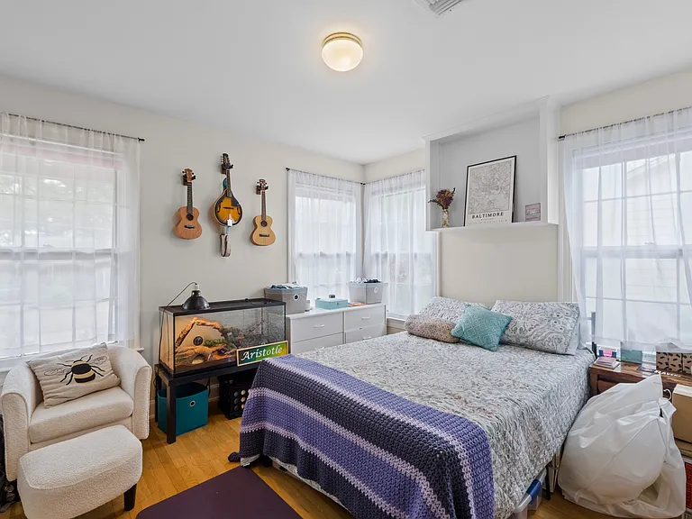 2nd bedroom with built-in shelves and great natural light
