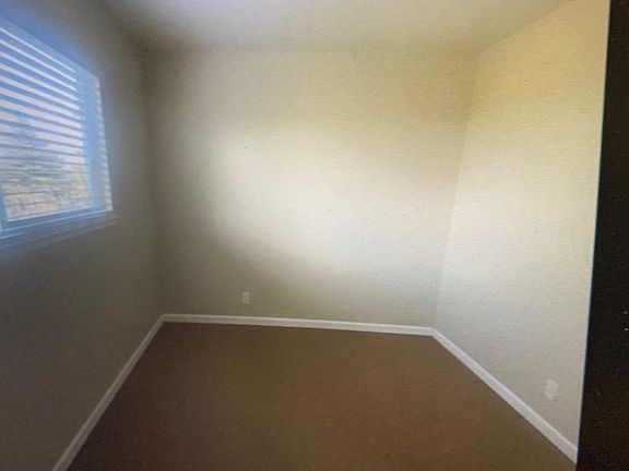 Another smaller bedroom that looks out over Vallejo. Nice view of city lights at night.