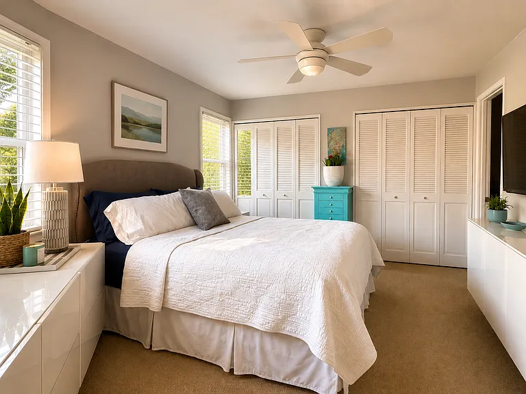 Guest bedroom - queen size bed with Sealy mattress, storage closets and built in cabinetry