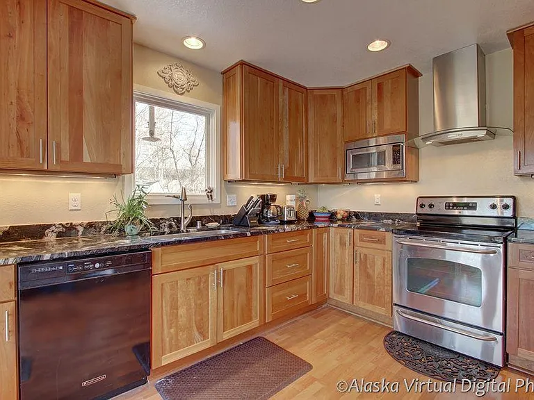 Gourmet Kitchen, titanium granite counters tops and high end stainless steel appliances.