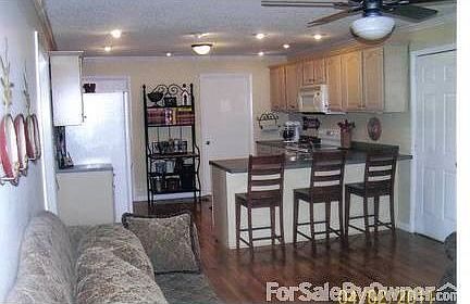 Kitchen
						:
						Plenty of cabinet space; well lit; Utility and sunroom are adjacent to kitchen.