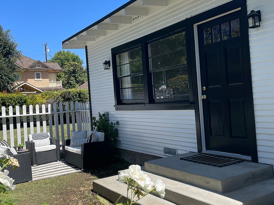 Entrance view of front door and private fenced yard
