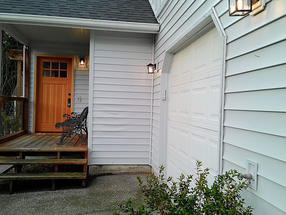Covered entry porch, single car garage and private driveway