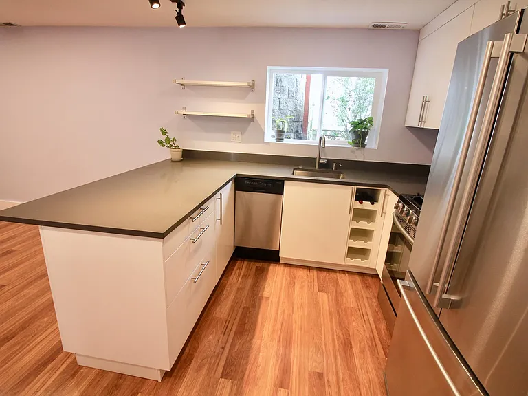 Kitchen includes economy dishwasher and wine rack