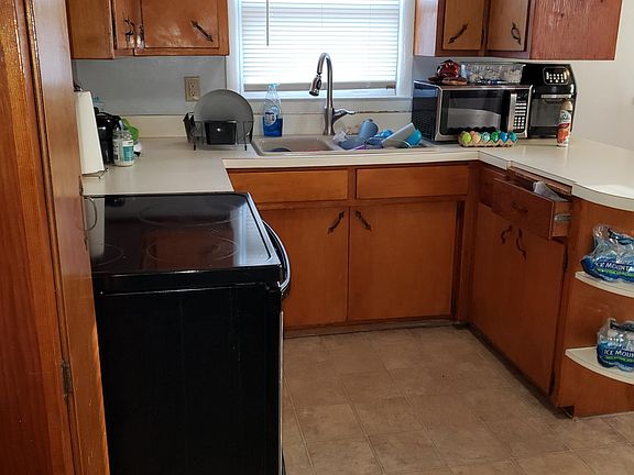 Kitchen With Stove and Refrigerator