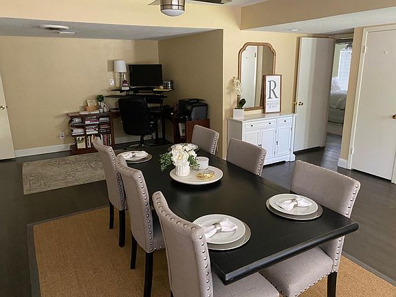 Sunlit entrance can be a dining room with an office area or a living room with a dining area