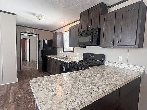 2nd image of 534 E 37th Ave Lot 387